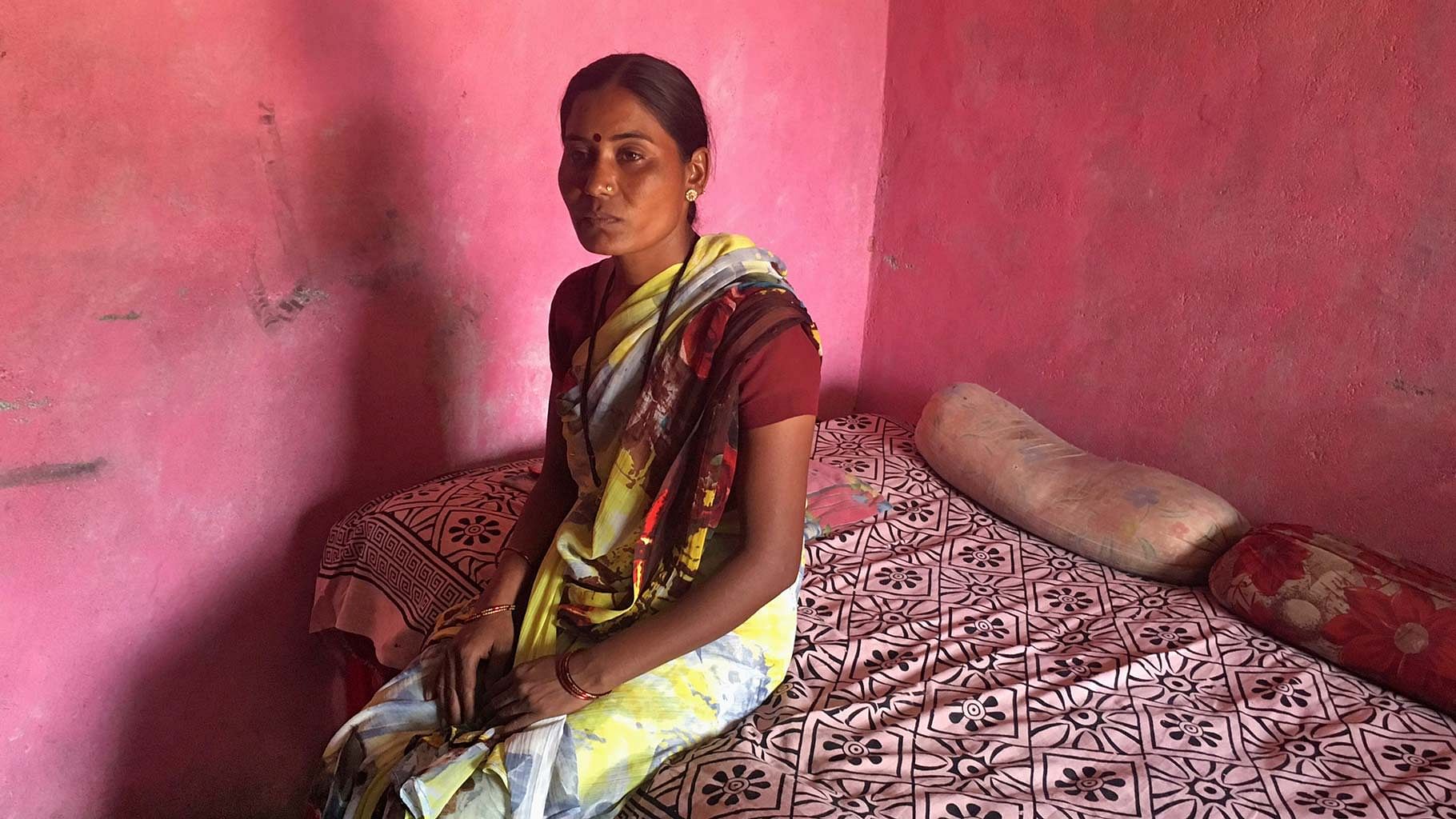 Joshna Wandile, a widow, poses inside her two-room house in Alipur village in Maharashtra. (Photo: Reuters)