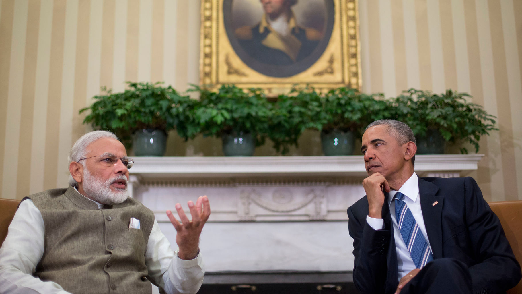 President Barack Obama listens as Indian Prime Minister India Narendra Modi speaks to members of the media during their meeting in the Oval Office. (Photo: AP)