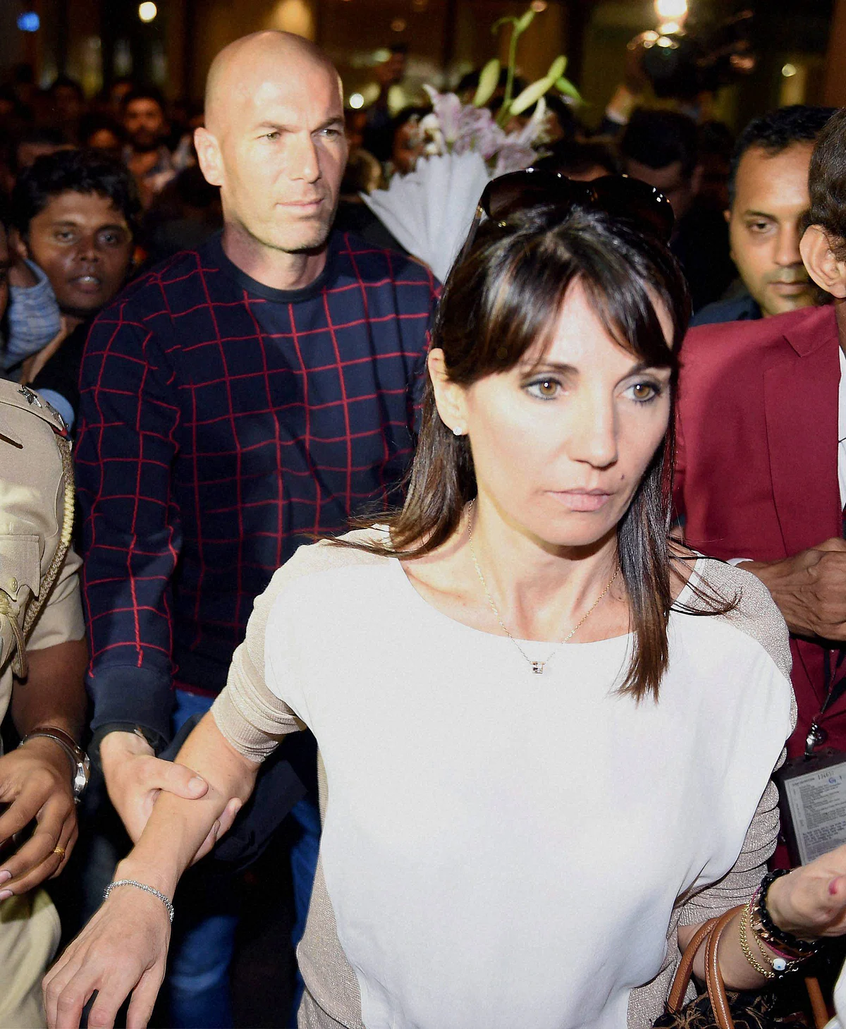 French footballer Zinedine Zidane with his wife Véronique Zidane at the International airport in Mumbai on Thursday. (Photo: PTI)