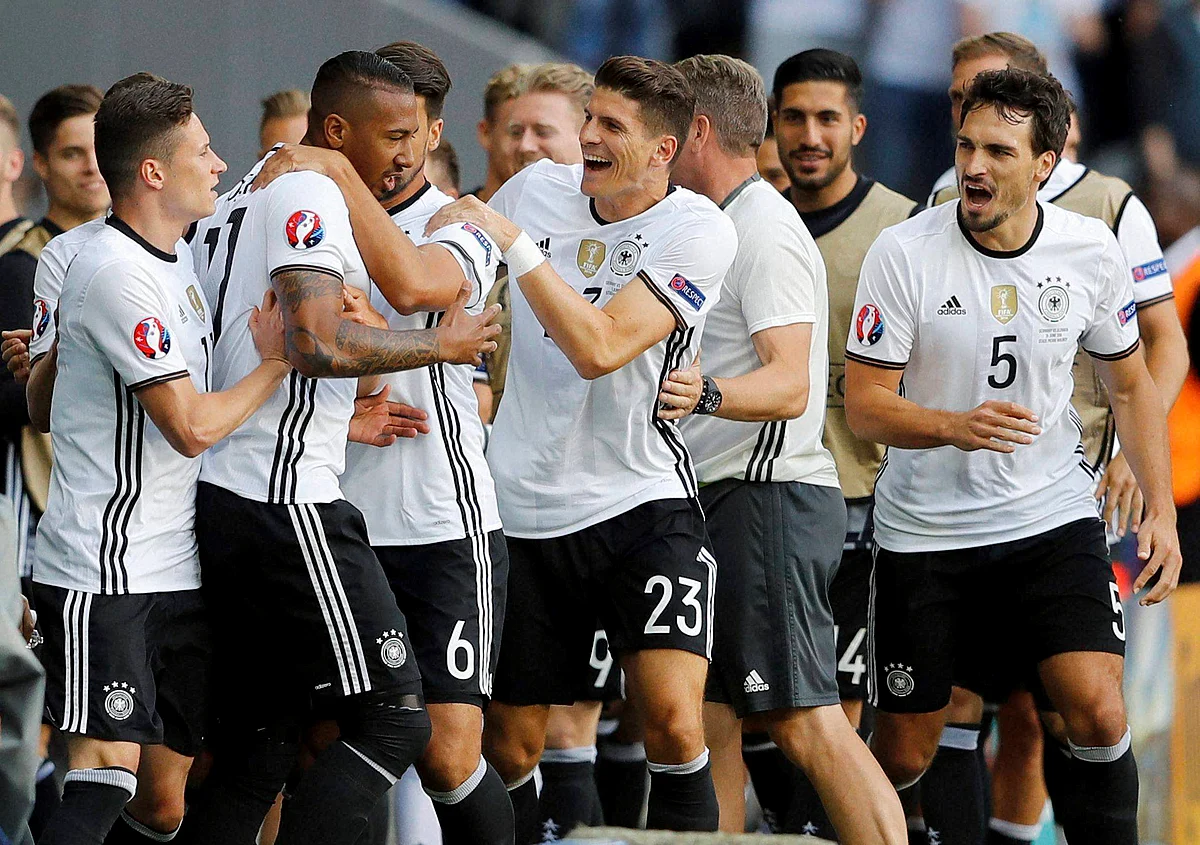 Germany’s Jerome Boateng celebrates with teammates after scoring his side’s first goal during the Euro 2016 round of 16 match between Germany and Slovakia. (Photo: AP)