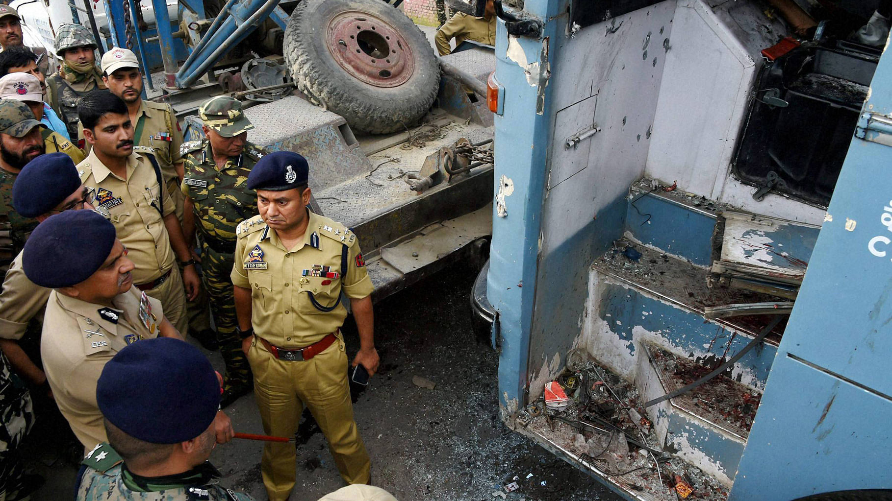 

Security forces inspecting the CRPF bus attacked by militants on the Srinagar-Jammu National Highway at Pampore in Srinagar, 25 June  2016. (Photo: PTI)