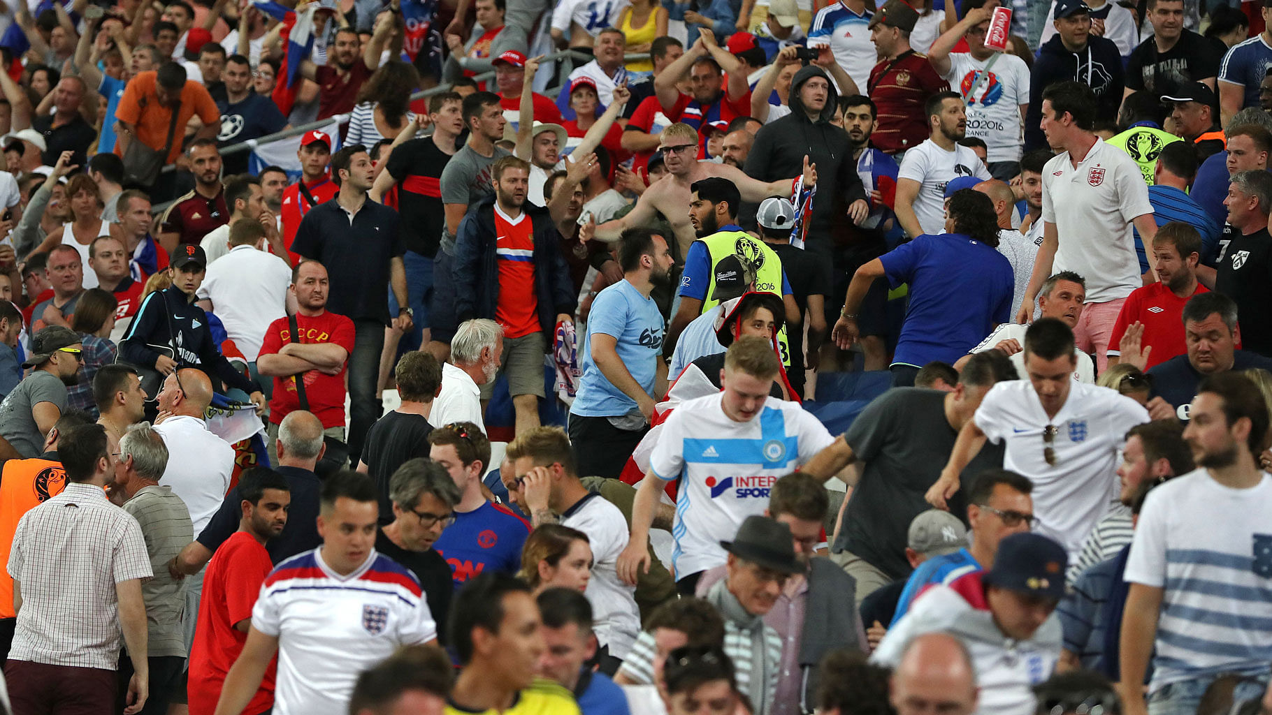 Russian supporters charge at England fans in the stands at the end of the match on 11 June. (Photo: AP)