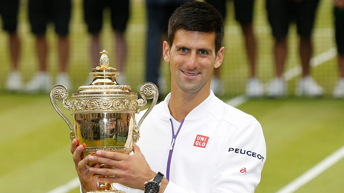 Novak Djokovic holds the trophy after winning Wimbledon in 2015. (Photo: Reuters)
