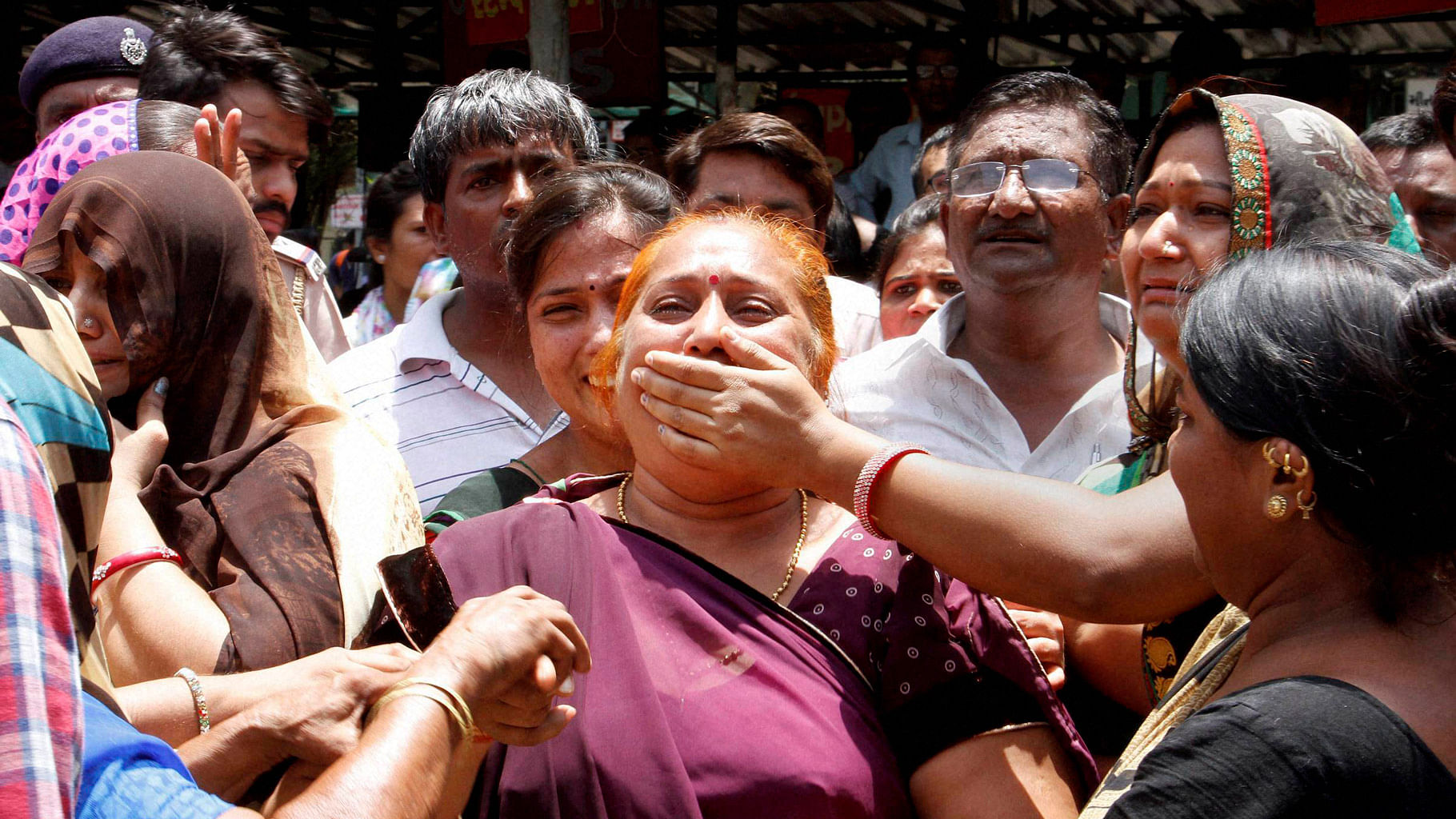 

Family members of the Gulbarg Society massacre case convicts react after the verdict in the case by a special SIT court in Ahmedabad on Thursday, 2 June 2016. (Photo: PTI)