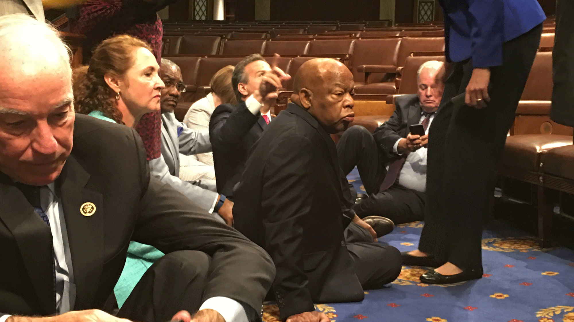 Democrat members of Congress participate in a sit-in, seeking  a vote on gun control measures. (Photo: AP)