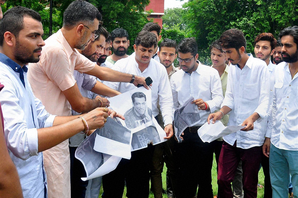 Members of the Bishnoi community burn photographs of Salman Khan in protest against the chinkara poaching case in which he was also acquitted. (Photo: PTI)