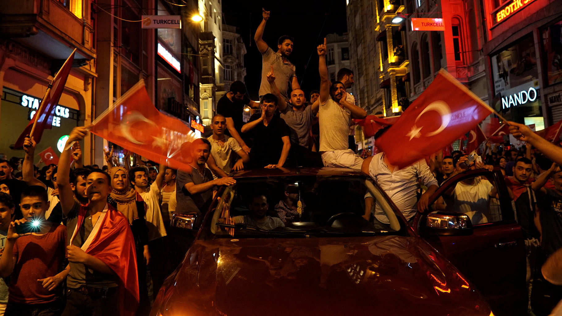 People chant slogans during a pro-government rally in central Istanbul’s Taksim square. (Photo: AP)