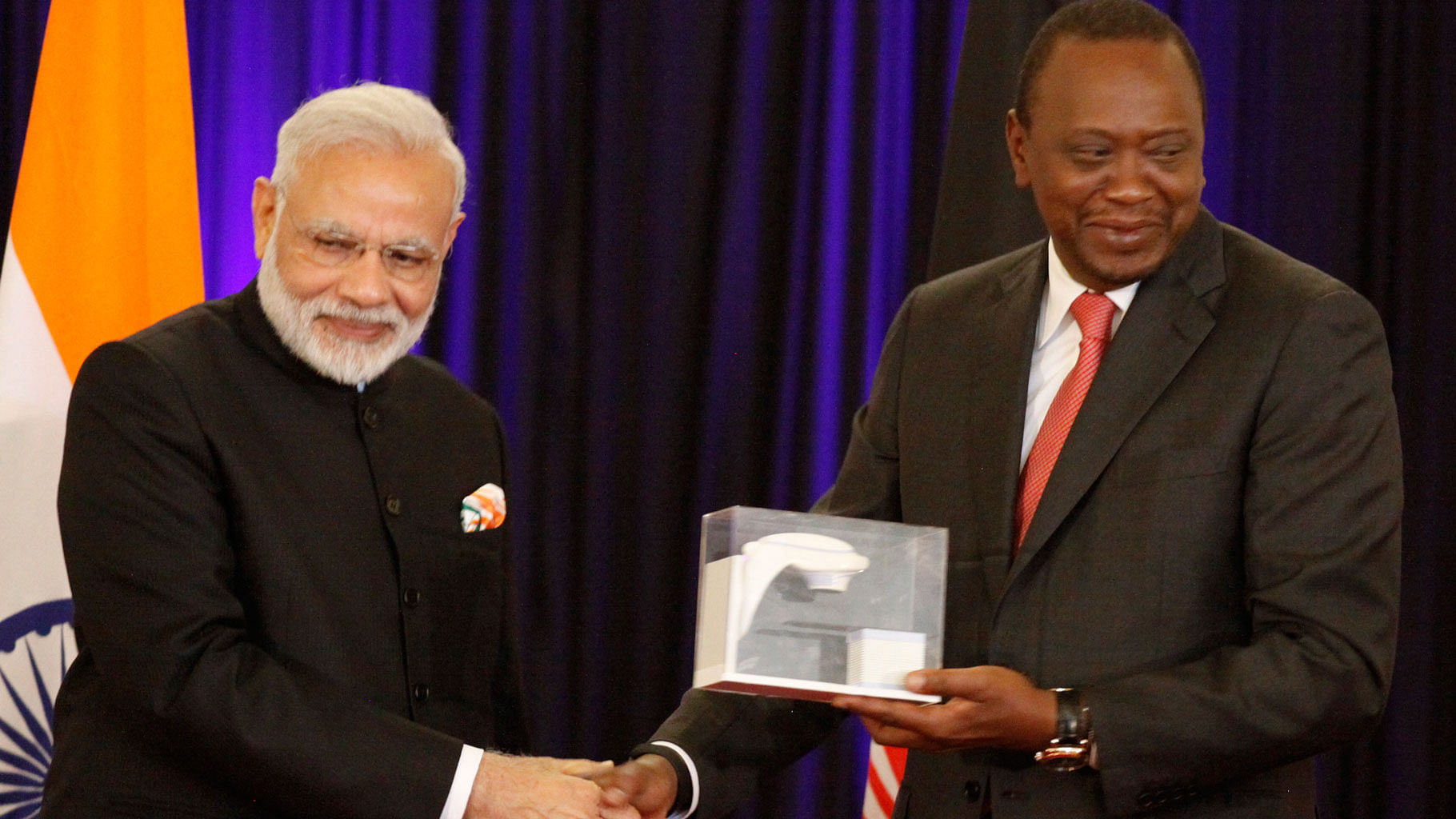 PM Narendra Modi presents a model of Bhabhatron to Kenyan President, Uhuru Kenyatta at State House in Nairobi, Kenya on Monday. (Photo: AP)