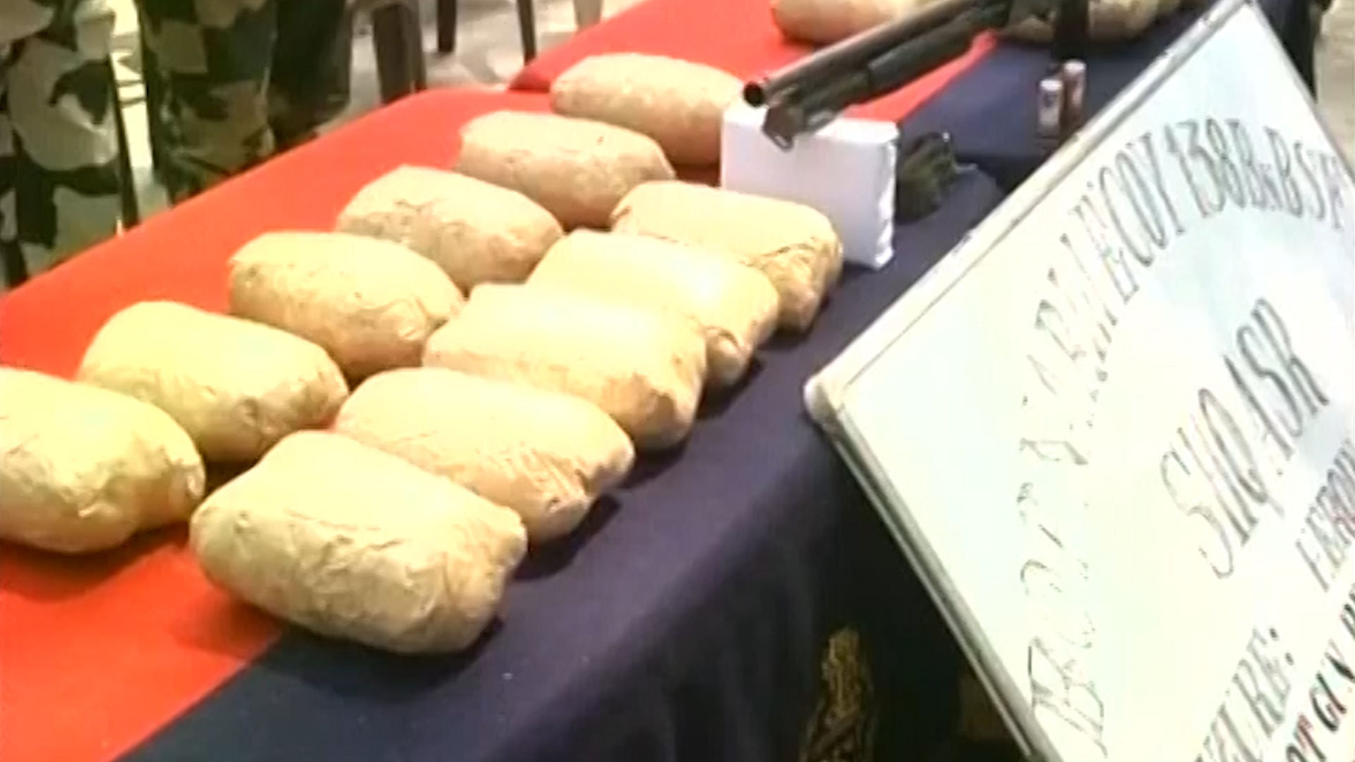 Heroin and ammunition seized from the smugglers. (Photo: ANI screengrab)