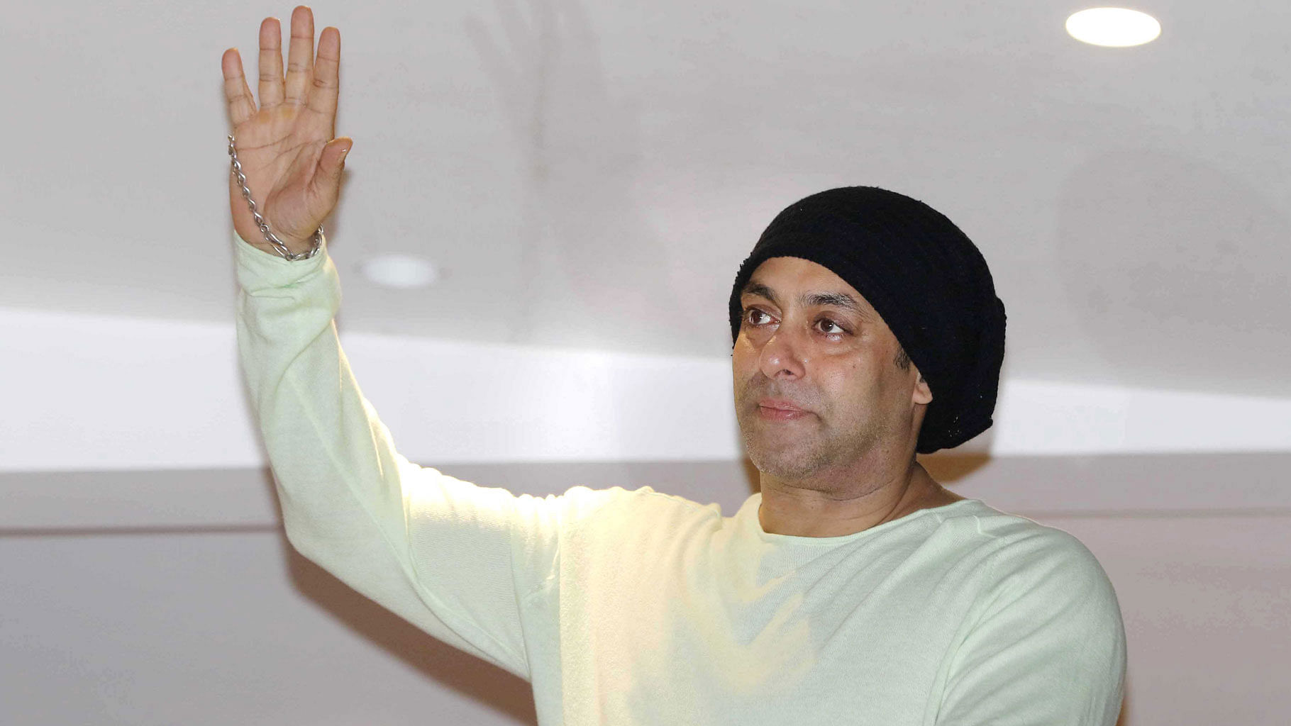 Salman Khan waves to fans from the balcony of his house in Mumbai on Eid. (Photo: Yogen Shah)