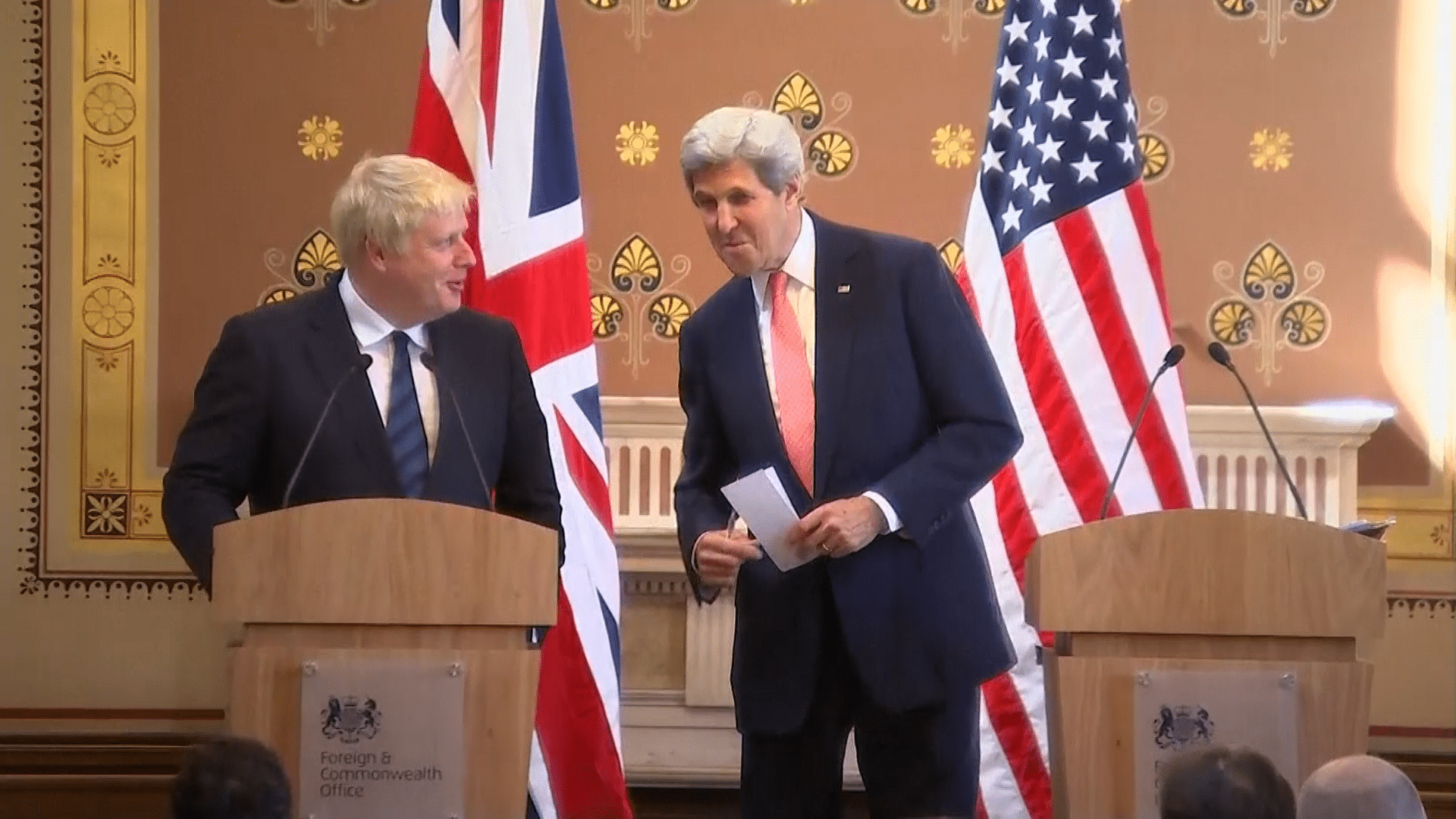 Boris Johnson and John Kerry try to keep things diplomatic at a press conference in London in front of unforgiving reporters. (Photo: AP/UK Pool Screengrab)