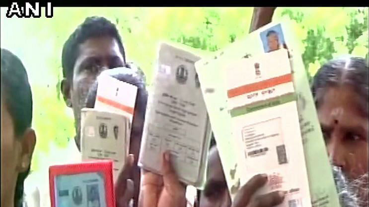 Dalit families return their voter and aadhar card. (Photo: ANI)