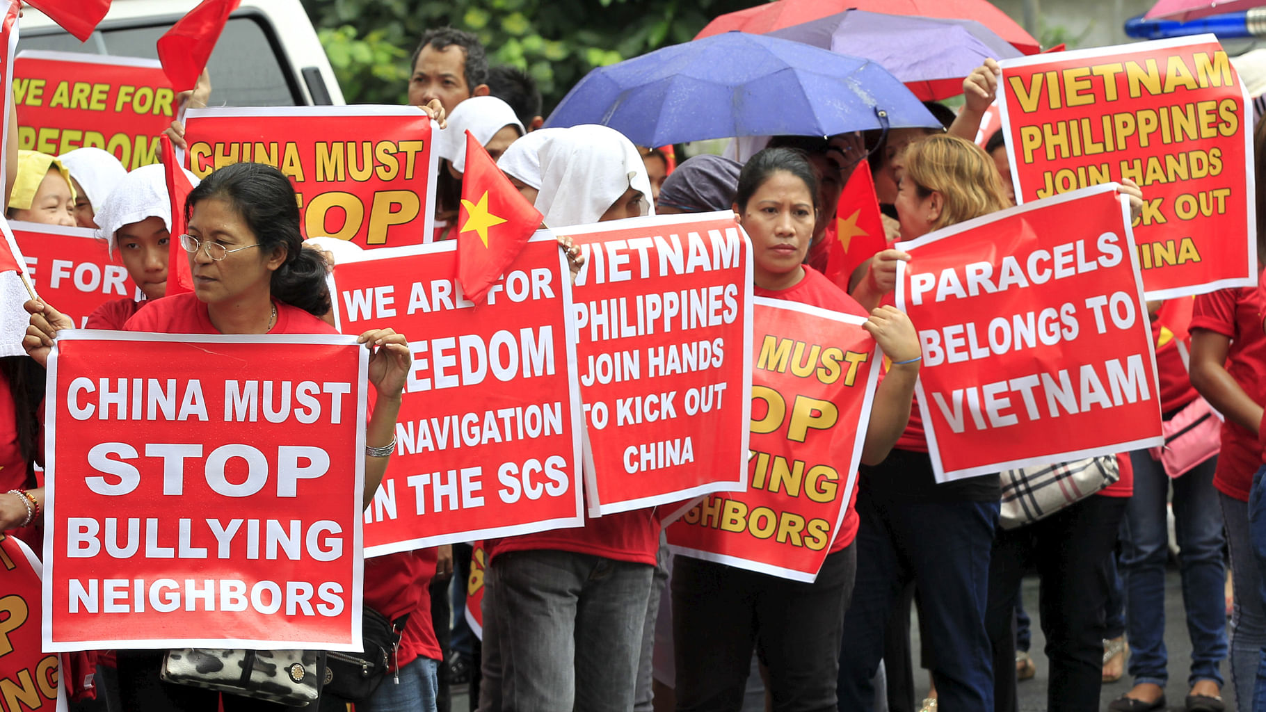 Protesters hold placards as they join in a protest rally to denounce China’s military buildup in the South China Sea,  metro Manila on 25 February, 2016. (Photo: Reuters)