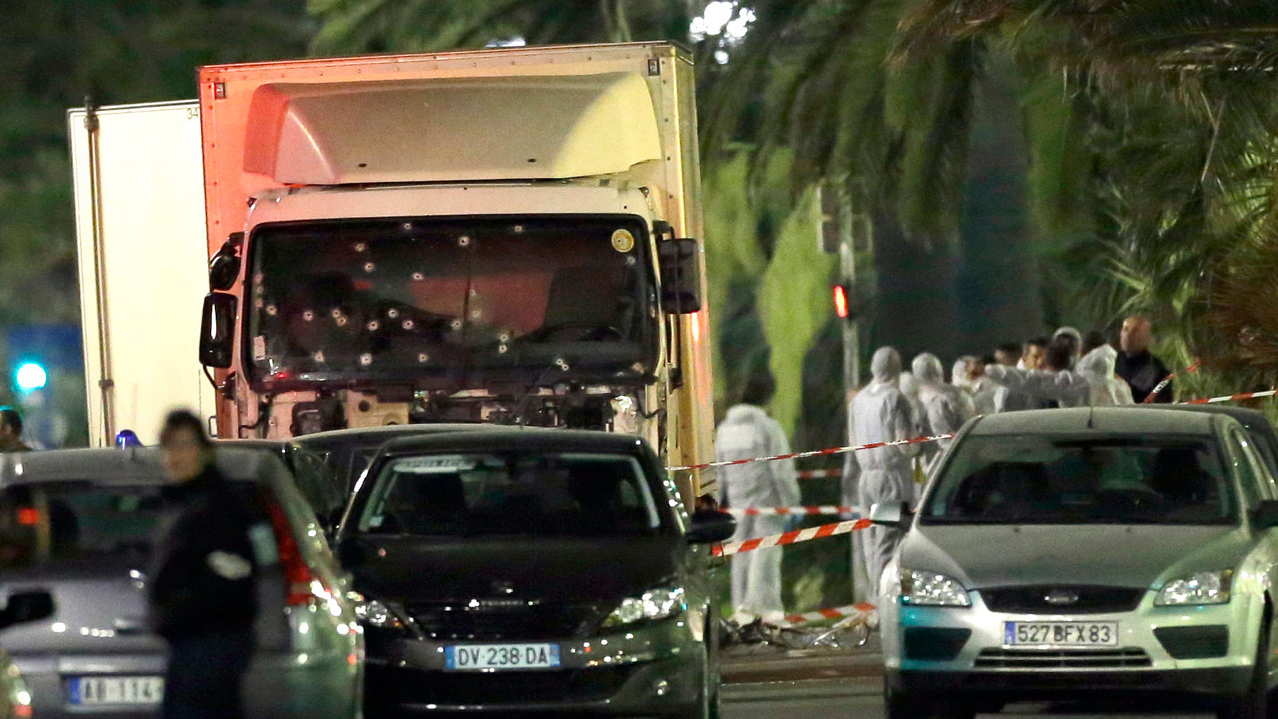 

Forensic officers stand near the truck that plowed through a crowd of revellers in Nice, Paris. (Photo: AP) 