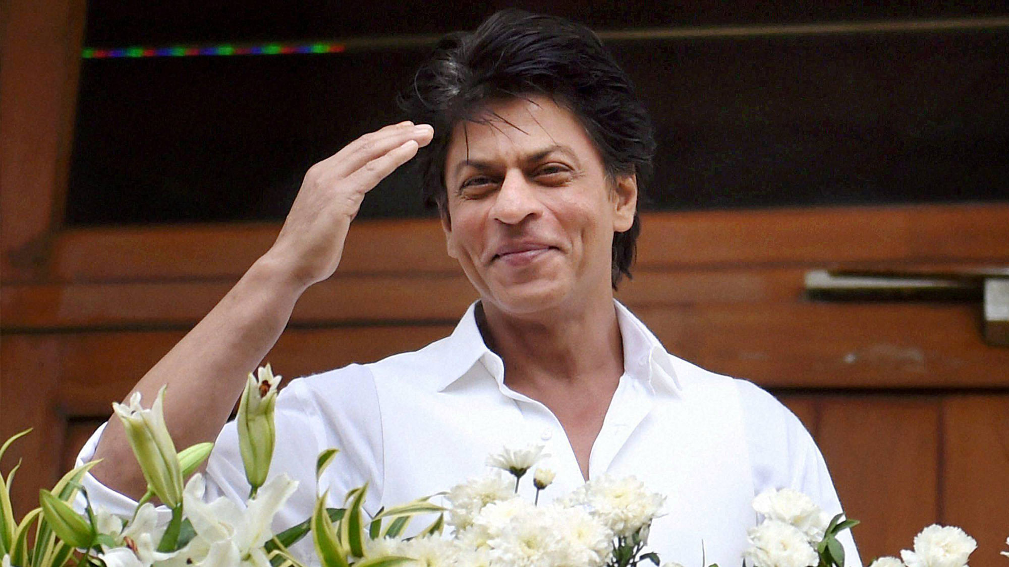 Actor Shahrukh Khan waves to his fans.&nbsp;