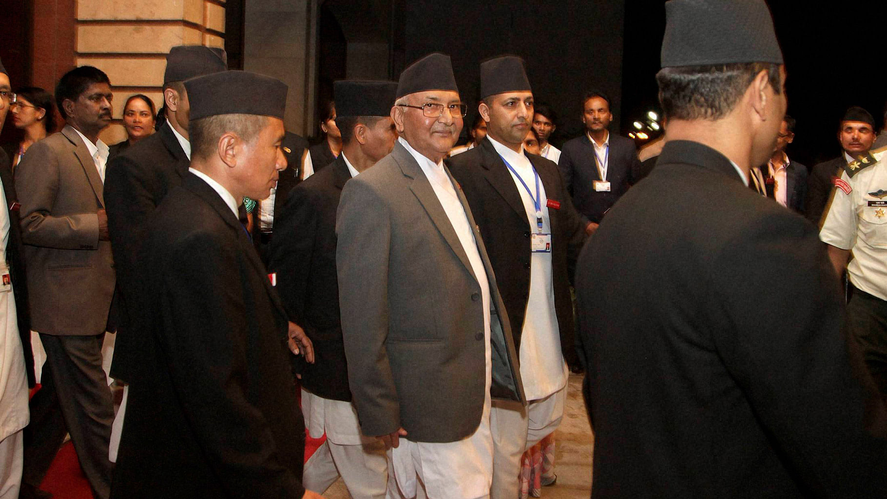 Nepals Prime Minister Khadga Prasad Oli, center walks out after informing the Parliament about his resignation in Kathmandu, Nepal. (Photo: PTI)