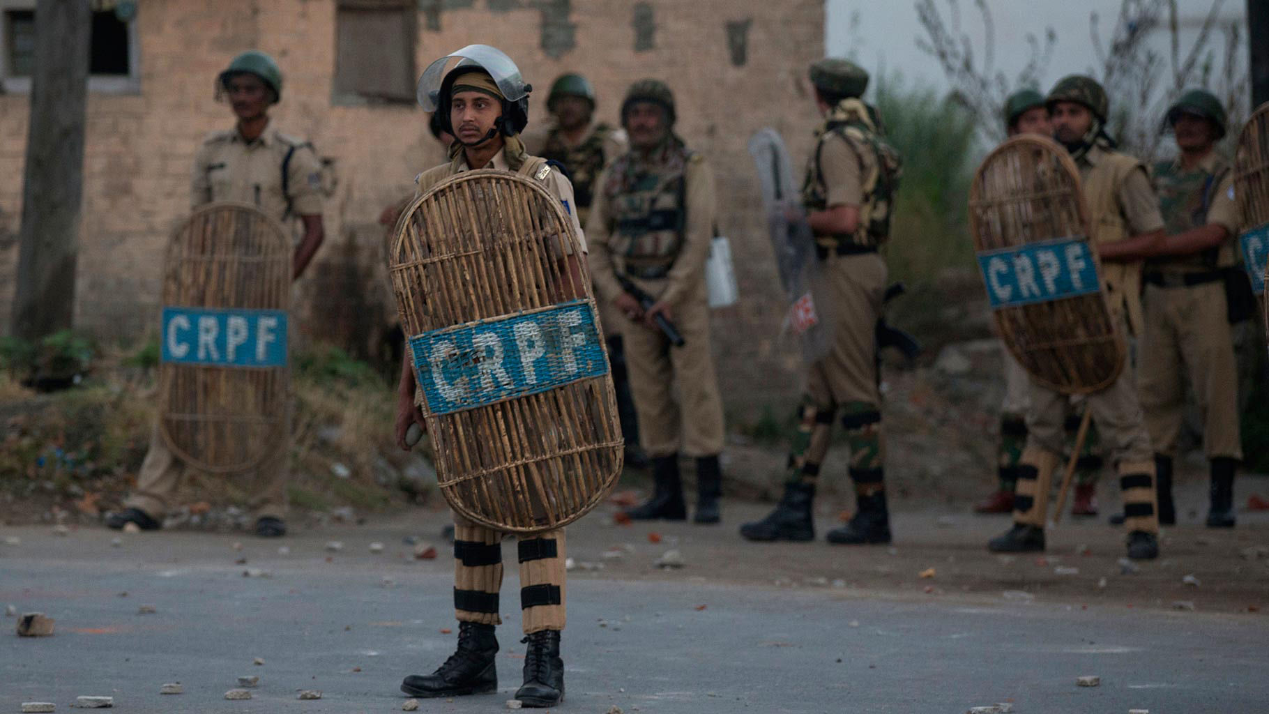 

CRPF soldiers watch as Kashmiri protesters throw stones and bricks at them during a protest in Srinagar, Kashmir, Wednesday, 20 July 2016. (Photo: AP)