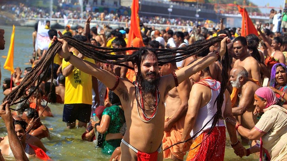 A holy man displays his hair after taking a dip in the River Kshipra during the Simhastha Kumbh Mela 2016, in Ujjain. (Photo: Reuters)