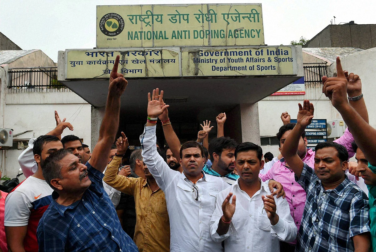 Supporters of Wrestler Narsingh Yadav shouts at NADA office l, in New Delhi on Wednesday. (Photo: PTI)
