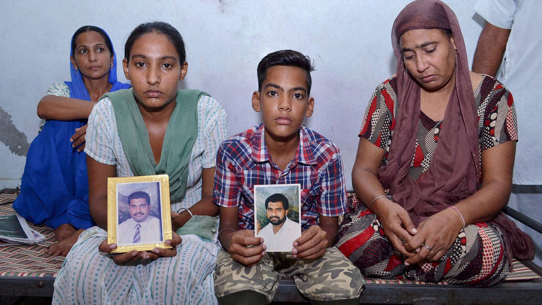 Gurdip Singh’s wife Kulwinder Kaur(R) and other family members, in Nakoda in Rajasthan. (Photo: PTI)