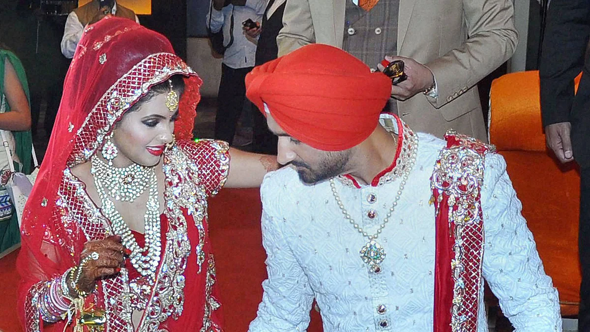 Harbhajan Singh and Geeta Basra at their wedding. (Photo: PTI)