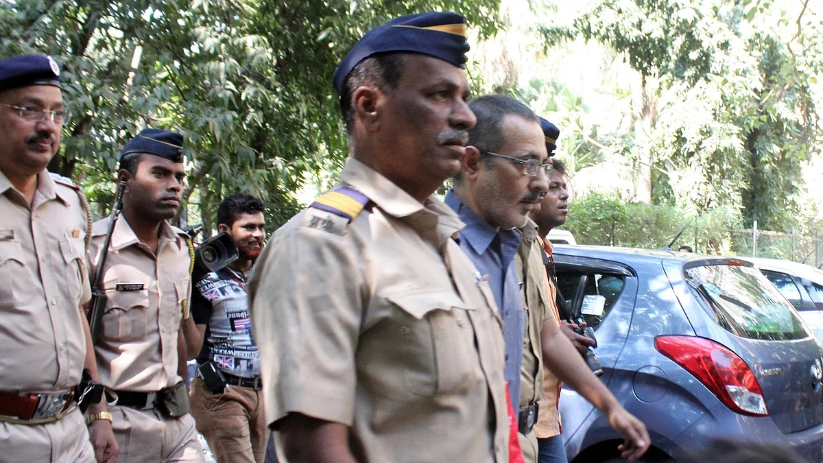 Sanjeev Khanna, suspected accused in Sheena Bora murder case after being produced at a Mumbai Court on November 20, 2015. (Photo: IANS)