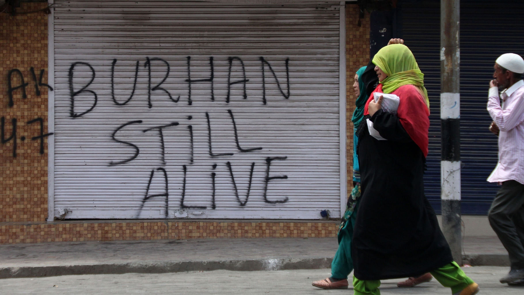A shop with a graffiti in honour of Burhan Wani, a senior militant commander who was killed in clashes with police and paramilitary forces last week in Srinagar. (Photo: IANS)