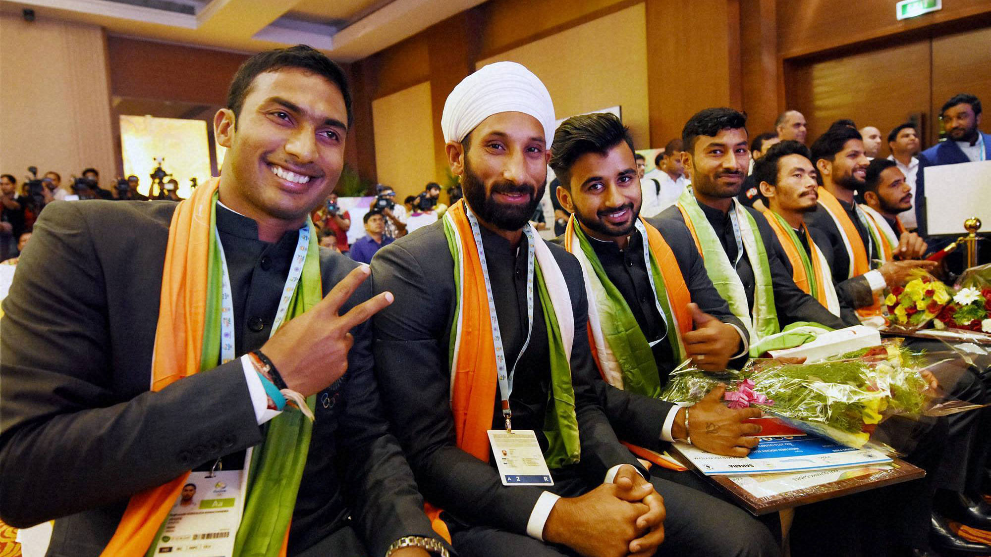 VR Raghunath with Sardara Singh and other team members after the announcement of the squad for Rio Olympics 2016. (Photo: PTI)