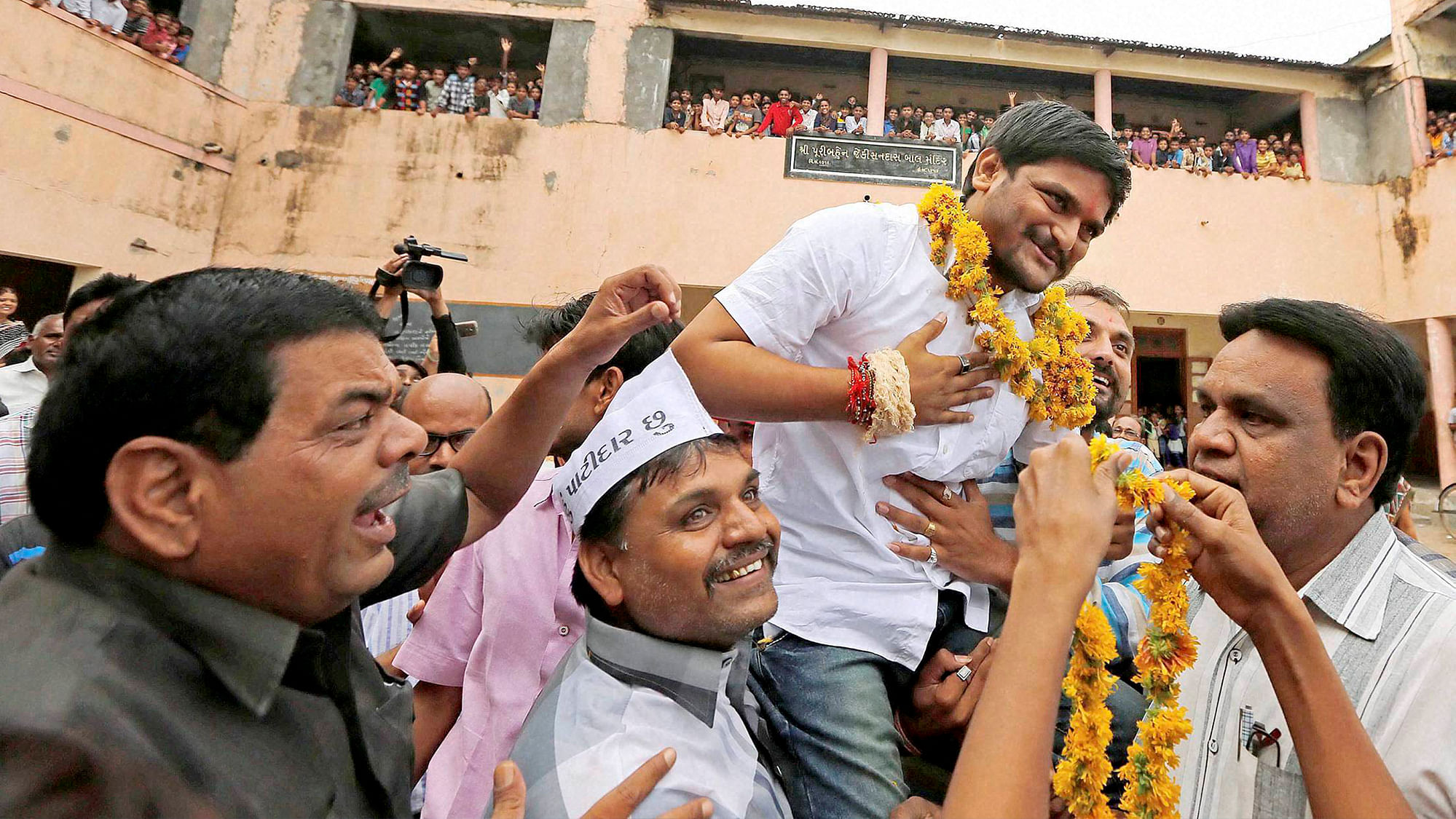 File Photo: People welcome PAAS convener Hardik Patel on arrival at his home town Viramgam some of 65 Kms from Ahmedabad on Saturday.&nbsp;