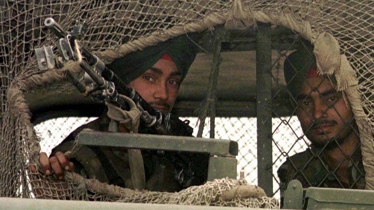 Indian army officers look out from their vehicle covered with camouflage netting near Drass in the Kargil region of Kashmir. (File photo: Reuters)