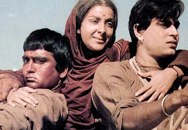 Rajendra Kumar with Sunil Dutt and Nargis in <i>Mother India.</i>
