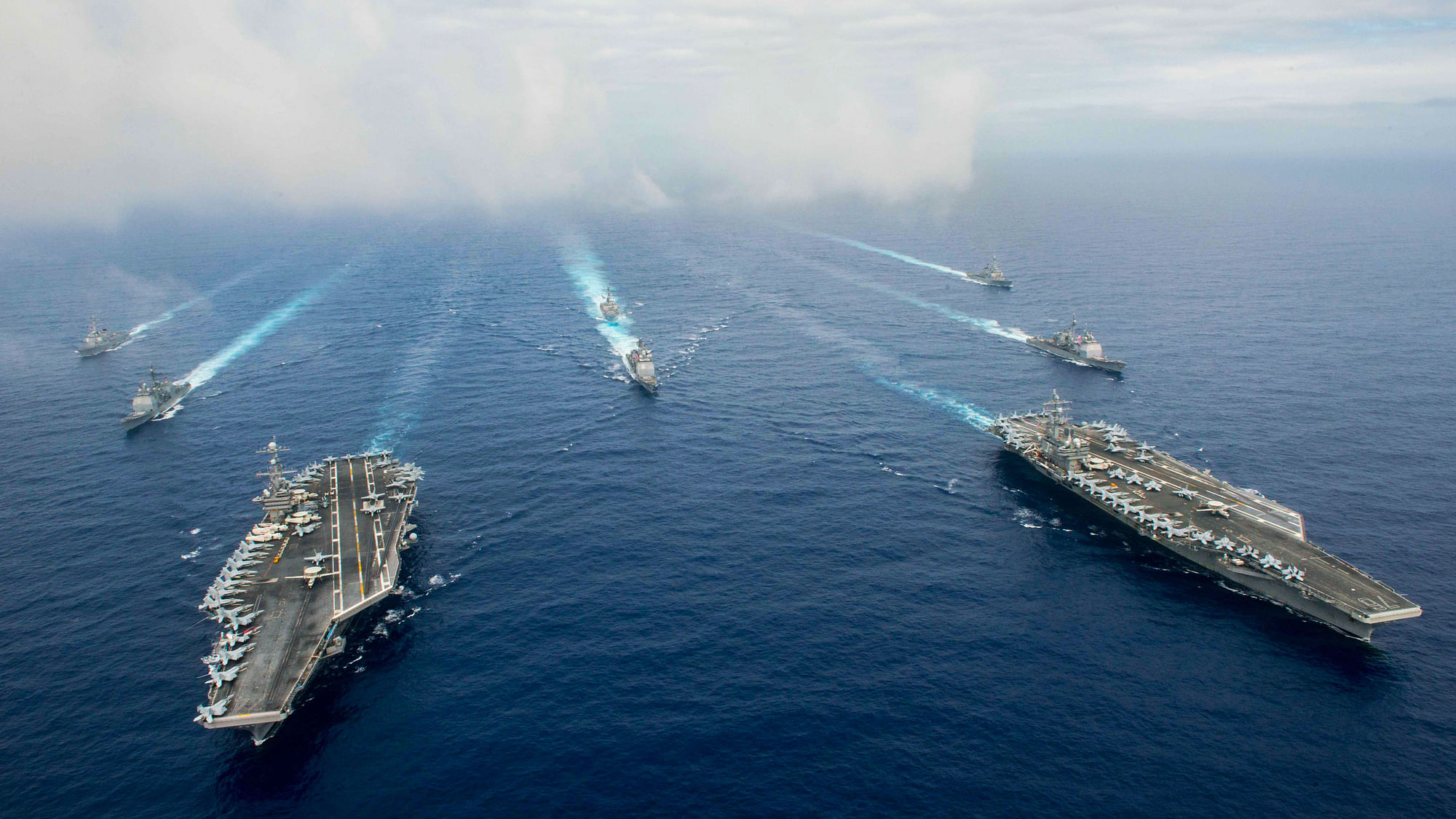 The Nimitz-class aircraft carriers USS John C Stennis, and USS Ronald Reagan (R)  on 18 June 2016. (Photo: Reuters)