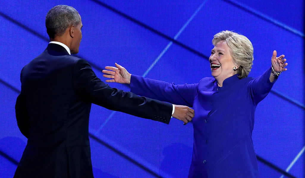 As Obama wrapped up his speech at the democratic convention, Clinton made a surprise appearance on stage to greet him. (Photo: AP)