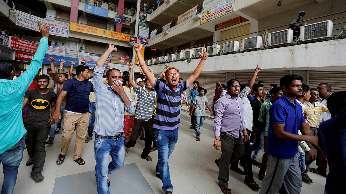 Members of Dalit Community forcing closure of markets in Ahmedabad on Wednesday. (Photo: PTI)