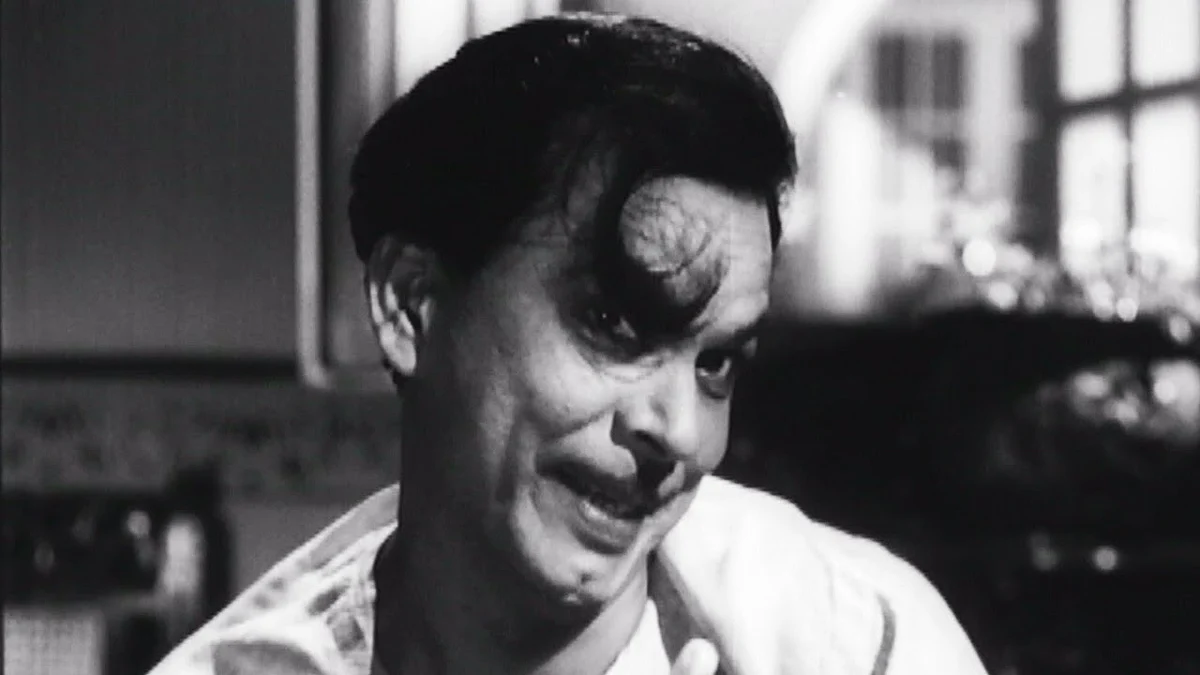 Johnny Walker in a comic scene from <i>Chaudhvin Ka Chand. </i>(1961).
