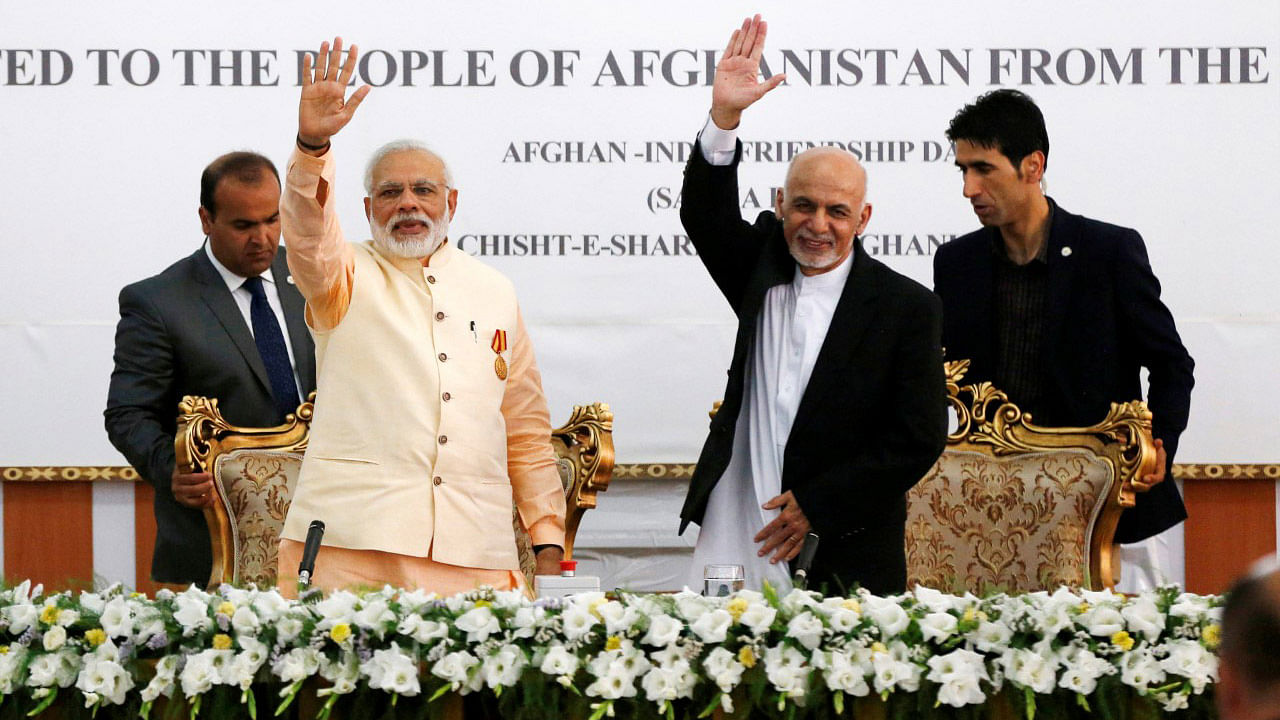 India’s Prime Minister Narendra Modi (L) and Afghanistan’s president Ashraf Ghani wave after the inauguration of the Salma Dam in Herat province, Afghanistan 4 June,2016. (Photo: Reuters)