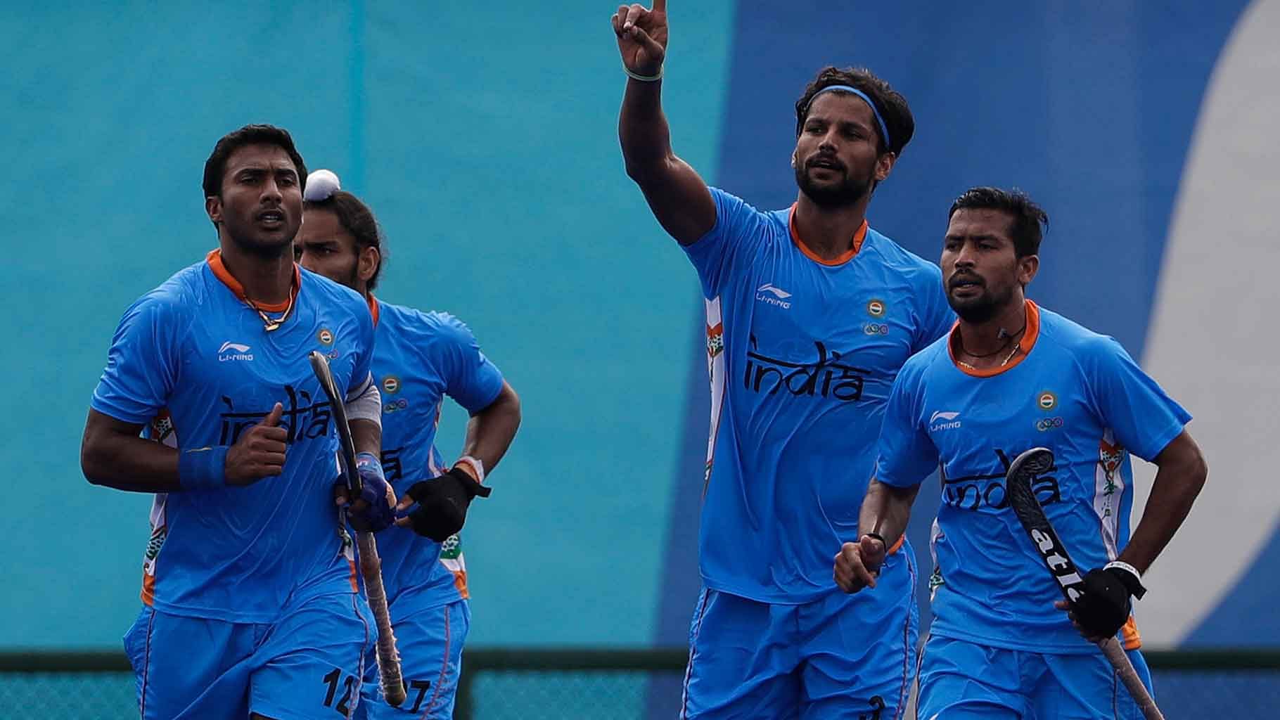 India’s Rupinder Pal Singh, center, celebrates his goal against Germany at the Rio Olympics. (Photo: AP)&nbsp;