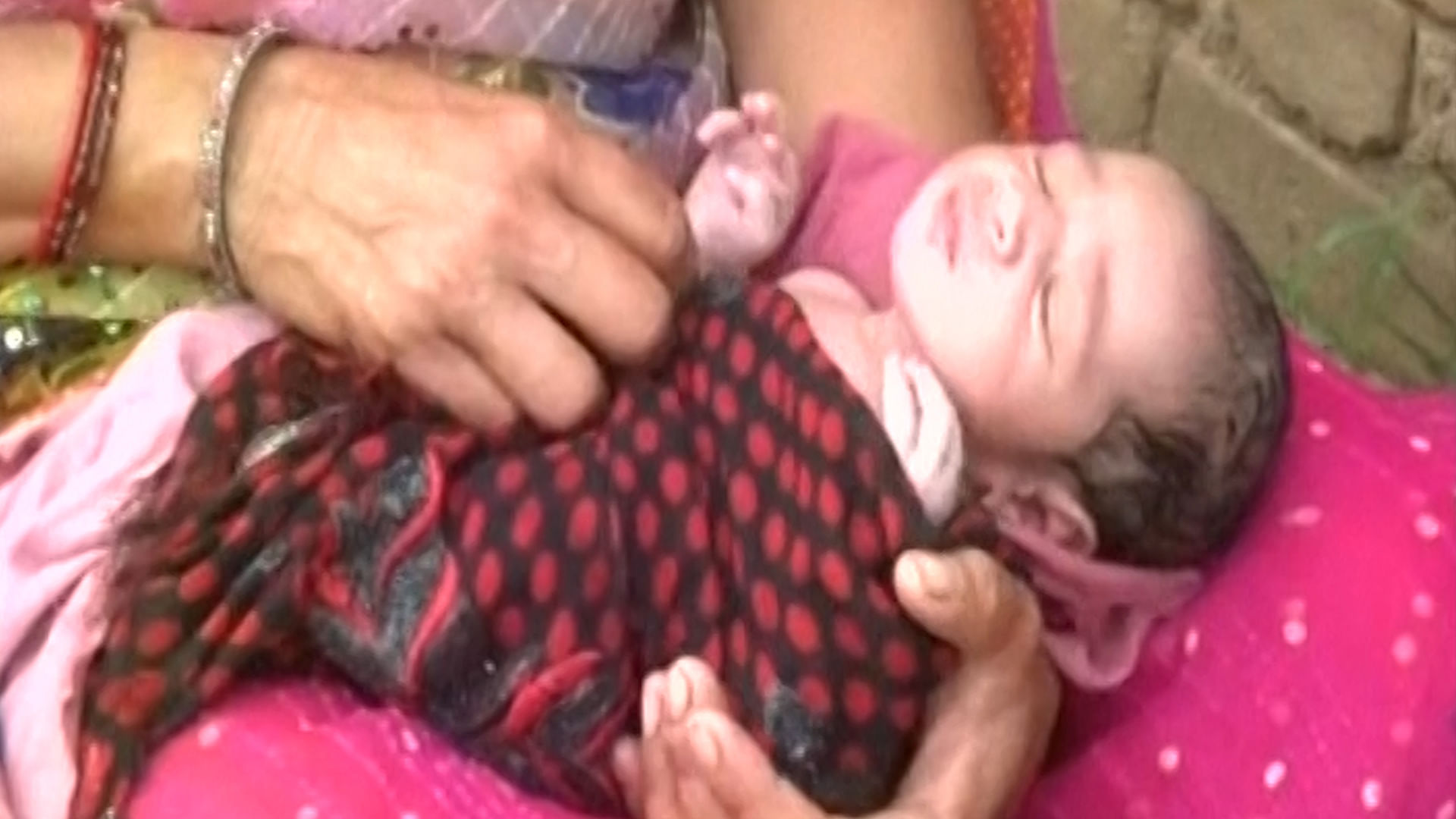 The affected woman delivered her baby in a boat. (Photo: ANI screengrab)