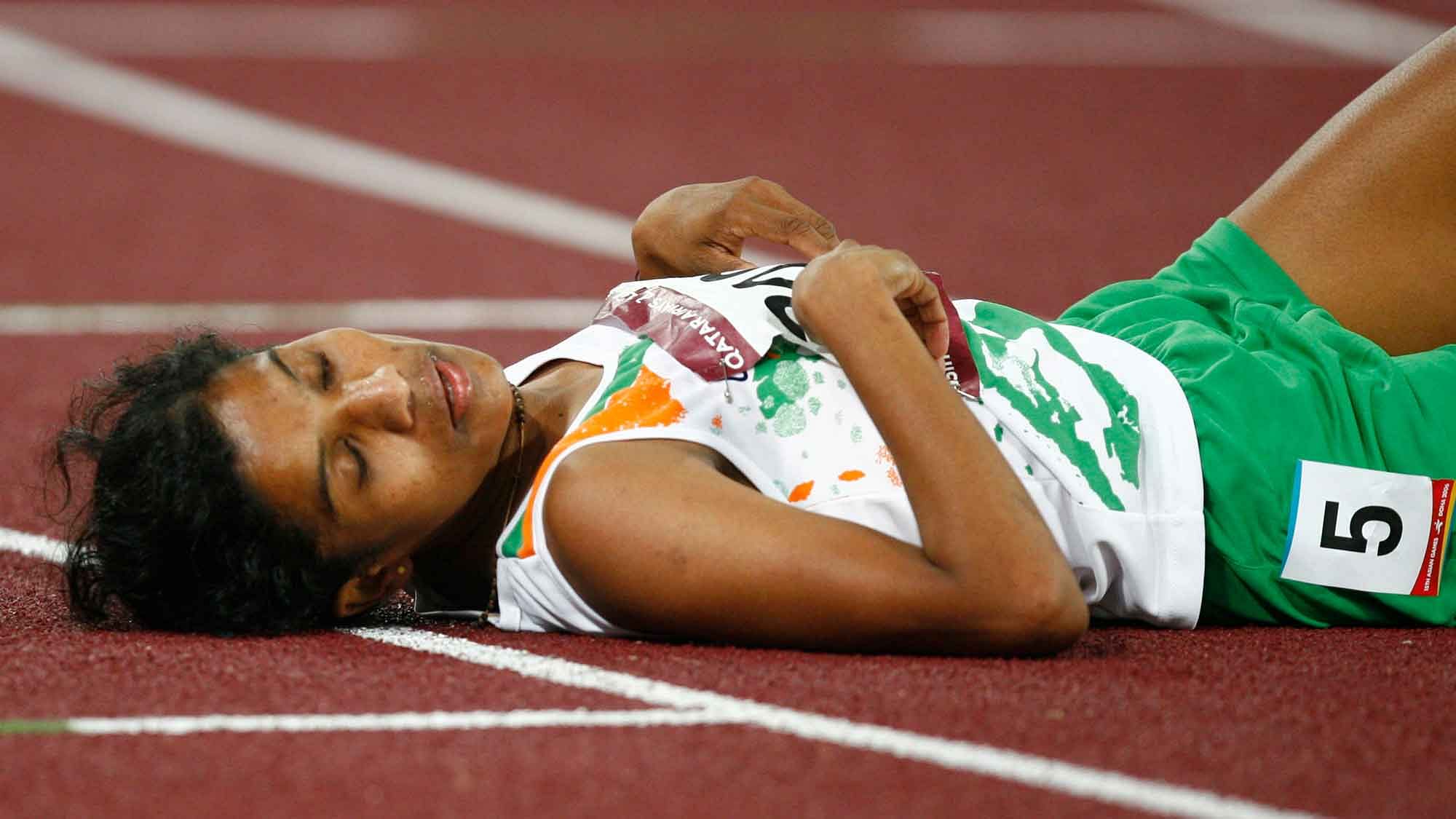 OP Jaisha on the track after the women’s 5000m final at the 15th Asian Games in Doha on 11 December 2006. (Photo: Reuters)