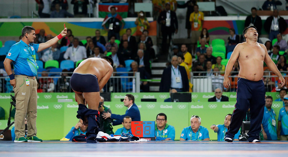 A Mongolian wrestler was penalised for dancing around his opponent in the last 18 seconds of their bout.