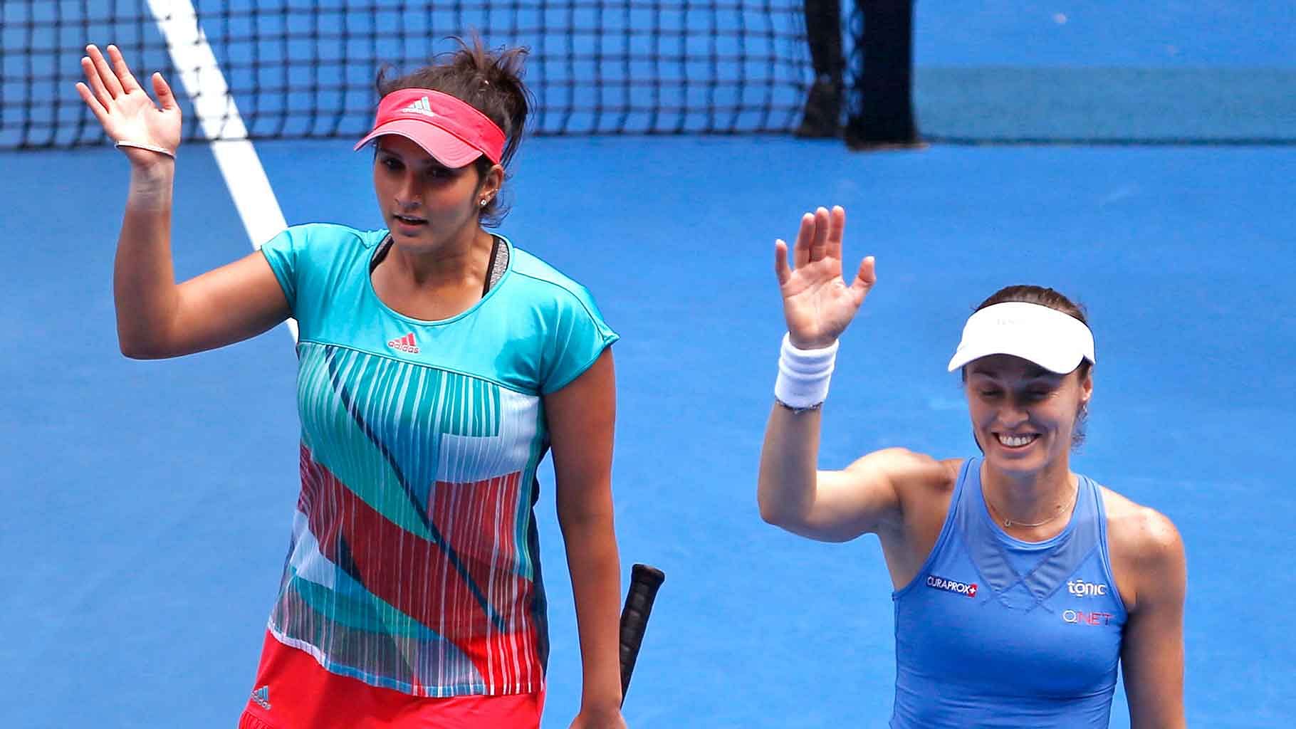 Sania Mirza (L) and Martina Hingis (R) part ways after winning 9 titles together. (Photo: AP)