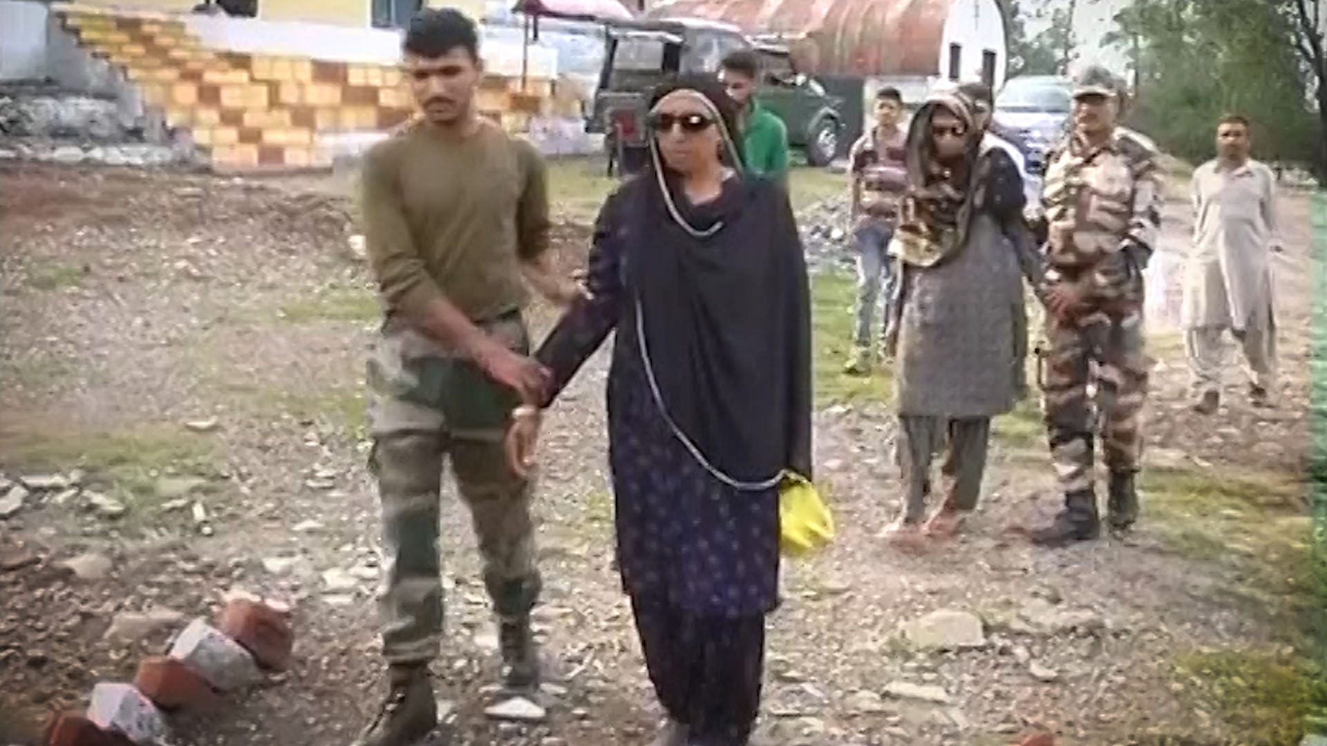 Indian army men assist visually impaired civilians to the eye check-up camp (Photo: ANI Screengrab)