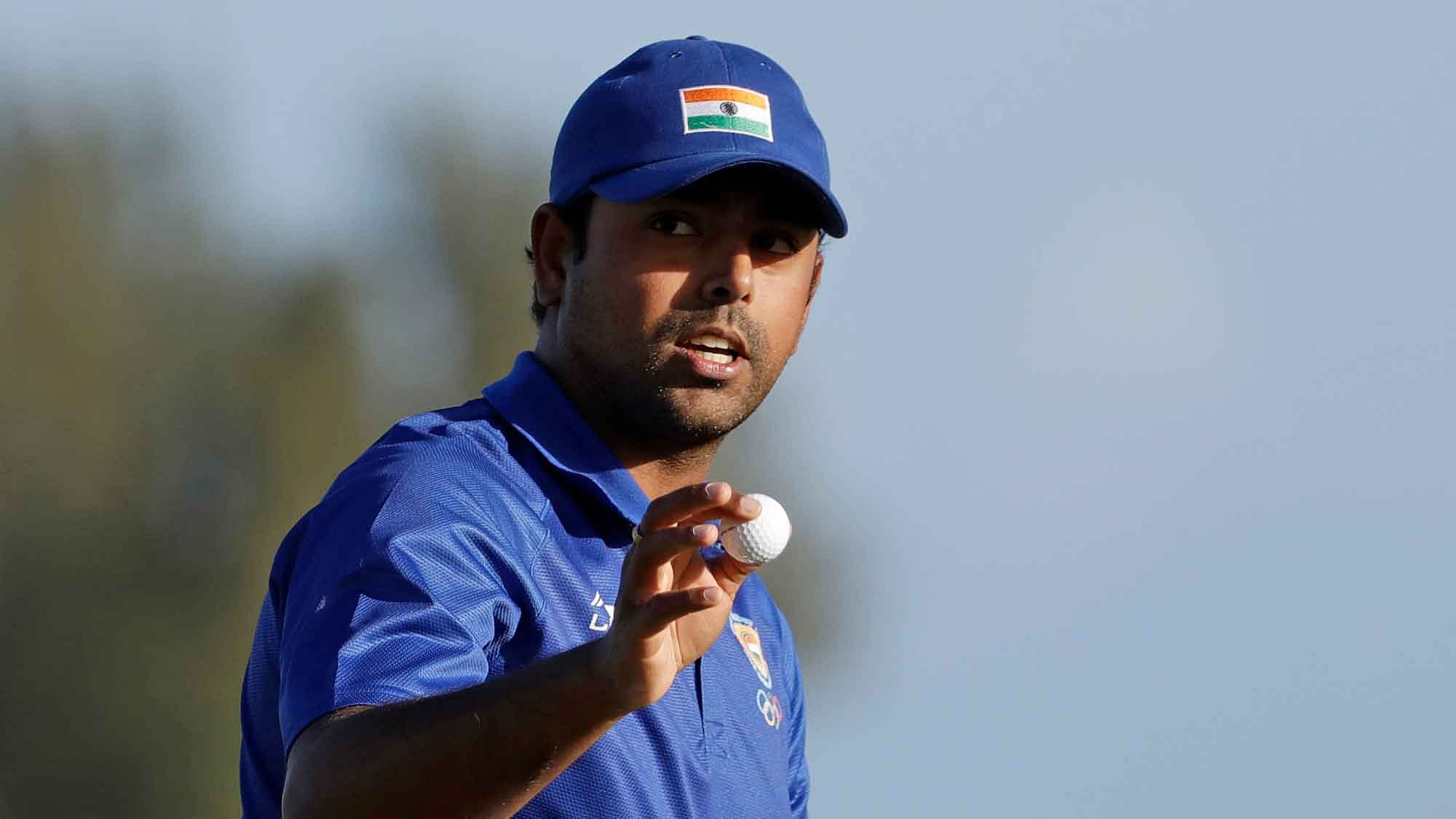 Anirban Lahiri, of India, holds his ball after finishing the 18th hole during the second round of the men’s golf event at the 2016 Summer Olympics (Photo: AP)