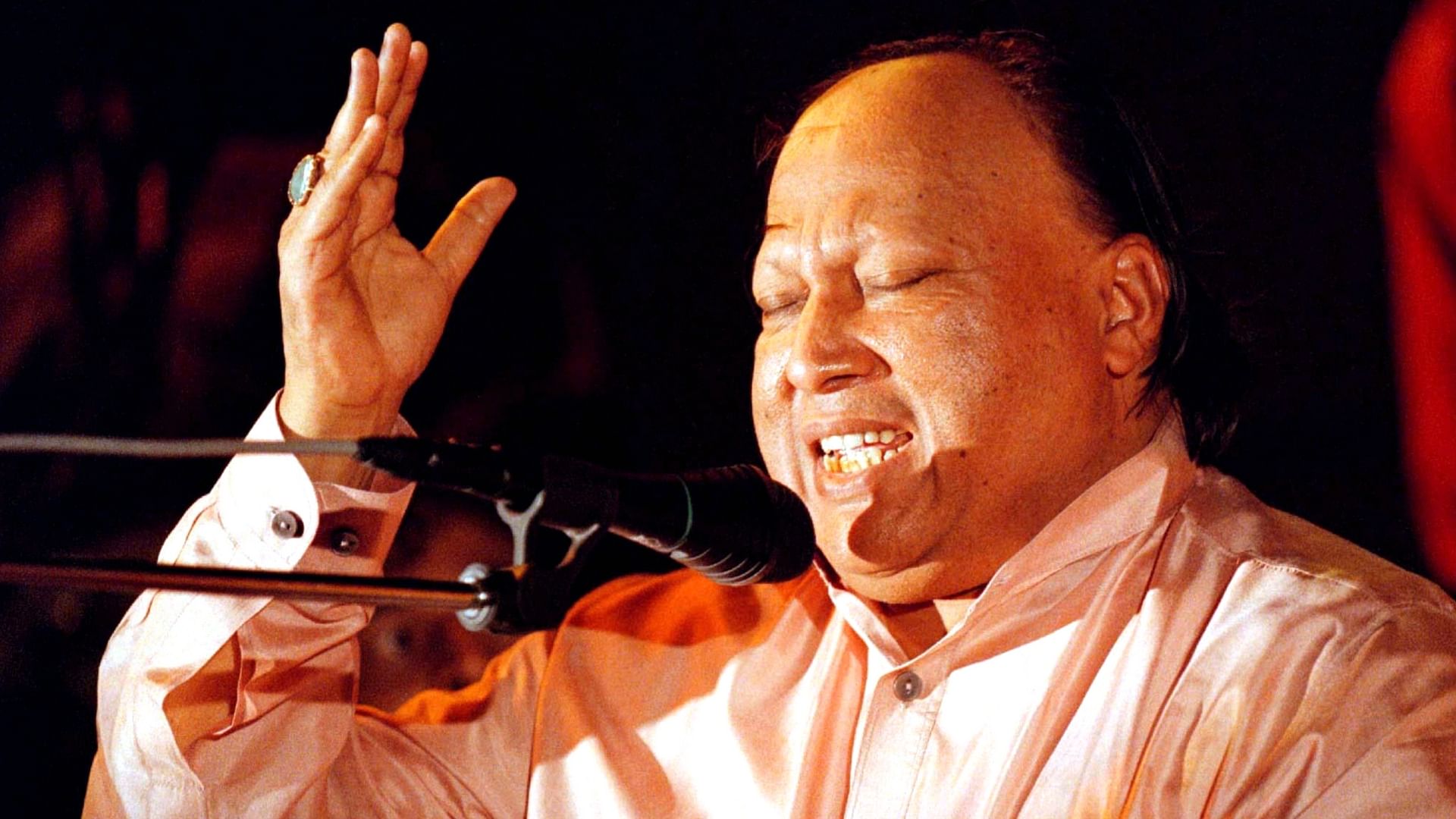 Pakistani musician Nusrat Fateh Ali Khan performs live on stage on... News  Photo - Getty Images