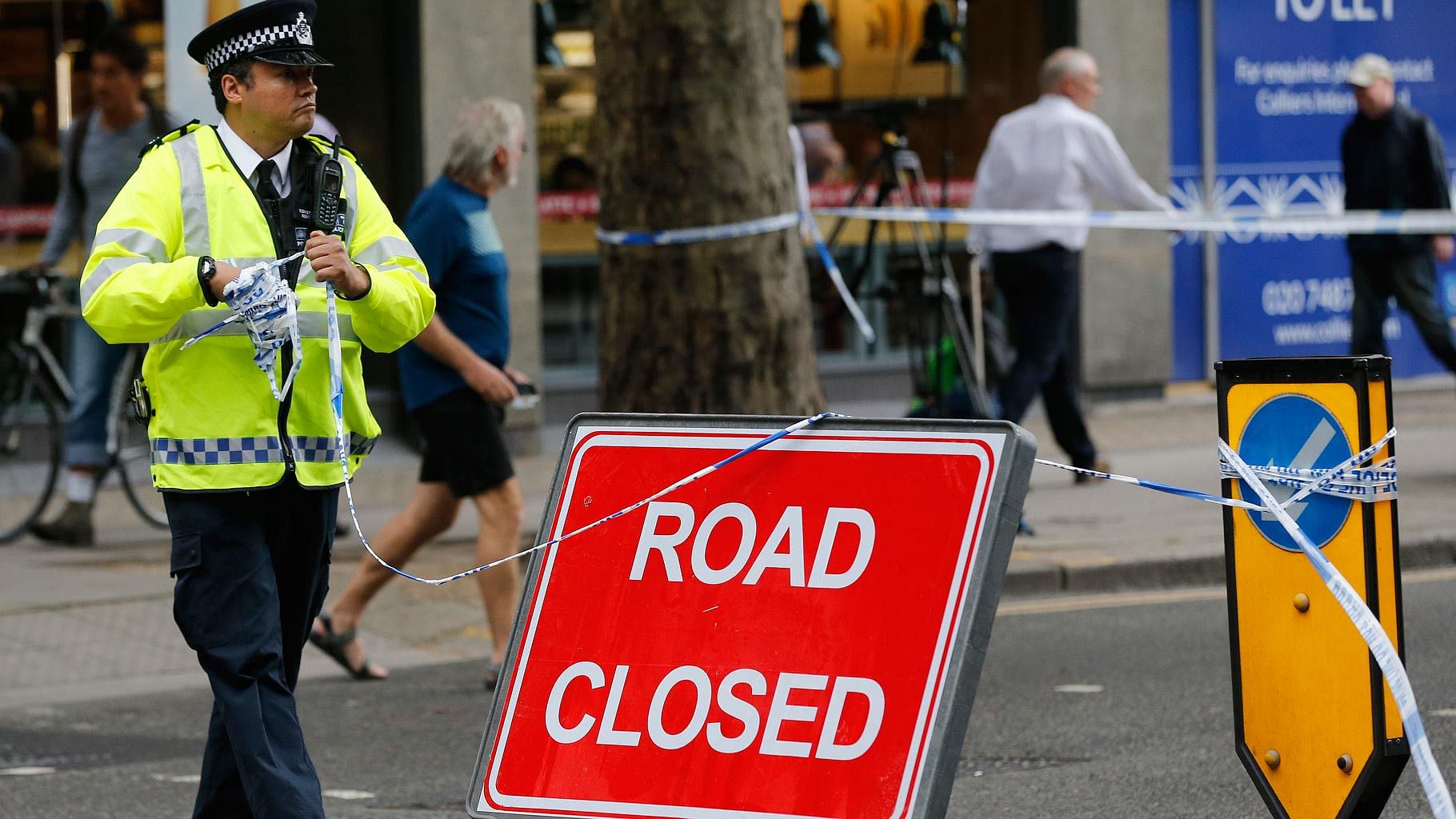 Police clear barricade tape from the scene of a knife attack near Russell Square in London, Thursday, on August 4, 2016. (Photo: AP)