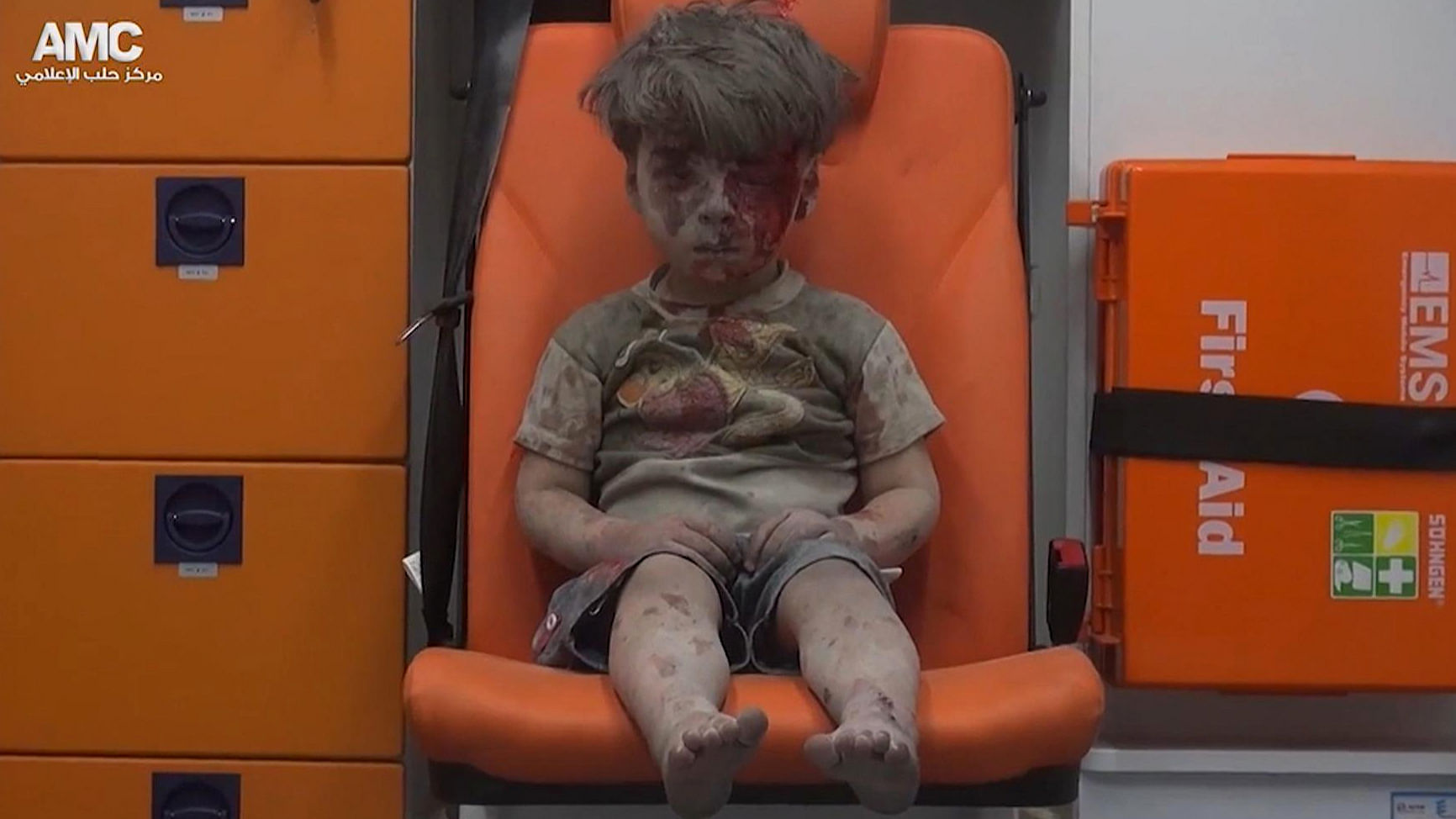 A child sits in an ambulance after being pulled out or a building hit by an airstirke in Aleppo, Syria. (Photo:<i> </i>AP)