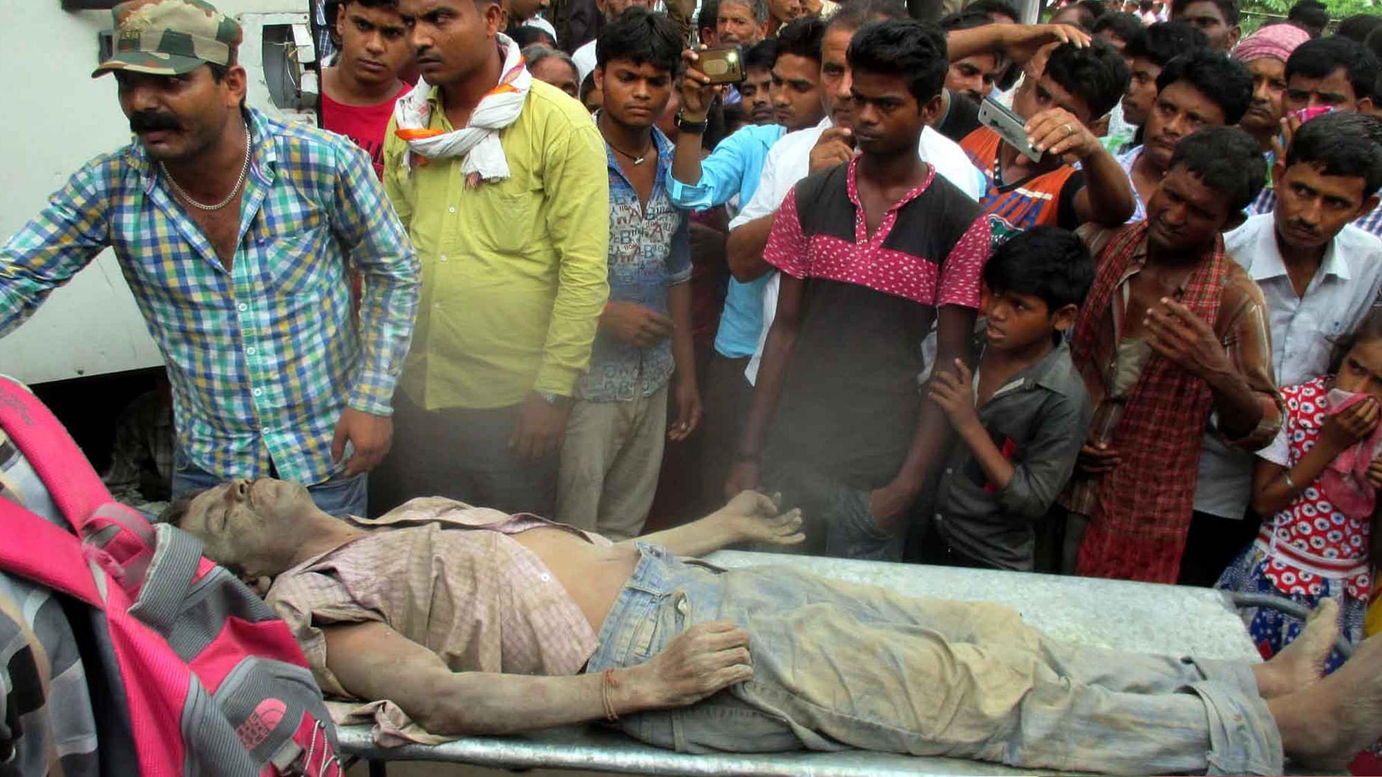 One of the victims of Gopalganj sudden deaths being taken away on 17 August 2016. At least 11 people died overnight under mysterious circumstances in Gopalganj district of Bihar. (Photo: IANS)