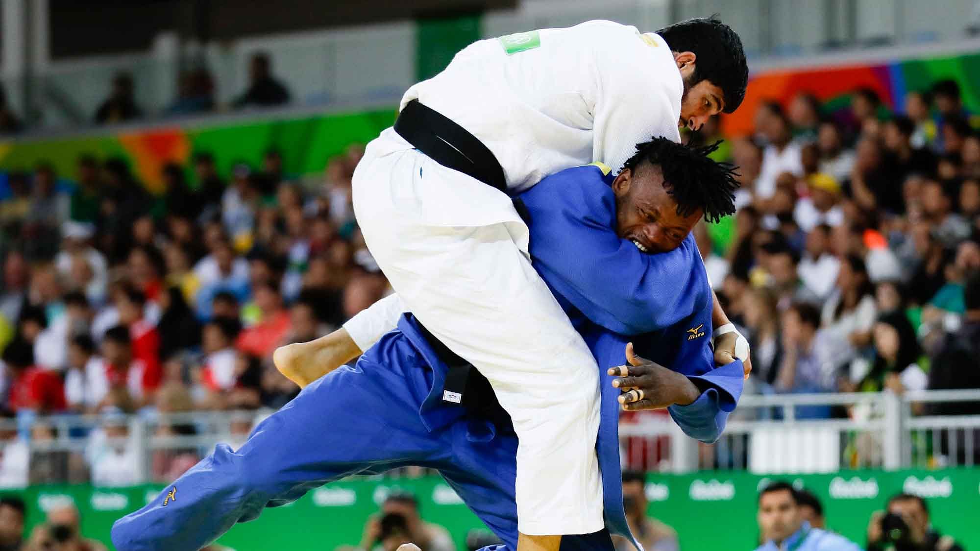 Popole Misenga, blue, of the Refugee Olympic Team, competes against India’s Avtar Singh during the men’s 90-kg judo competition at the 2016 Summer Olympics in Rio de Janeiro, Brazil, Wednesday, Aug. 10, 2016. (AP Photo/Markus Schreiber)