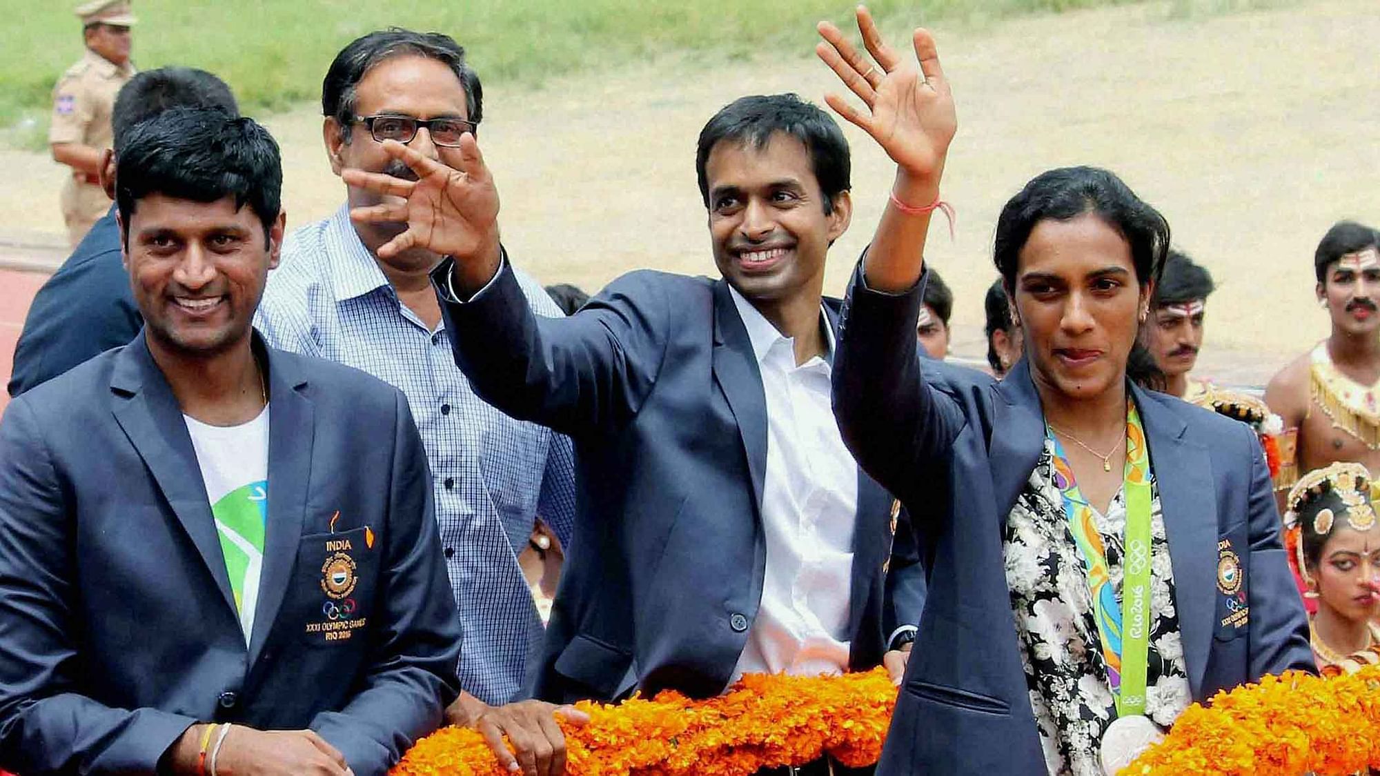 P V Sindhu and P Gopichand receive a rousing welcome after returning to Hyderabad. (Photo Courtesy: PTI)