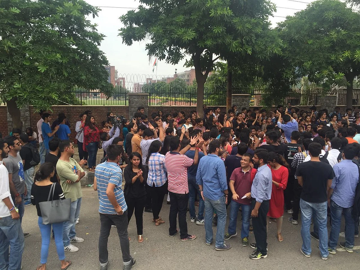 Students celebrate as two faculty members resigned on Friday. (Photo Courtesy: Twitter/ <a href="https://twitter.com/secondofhername">Secondofhername)</a>